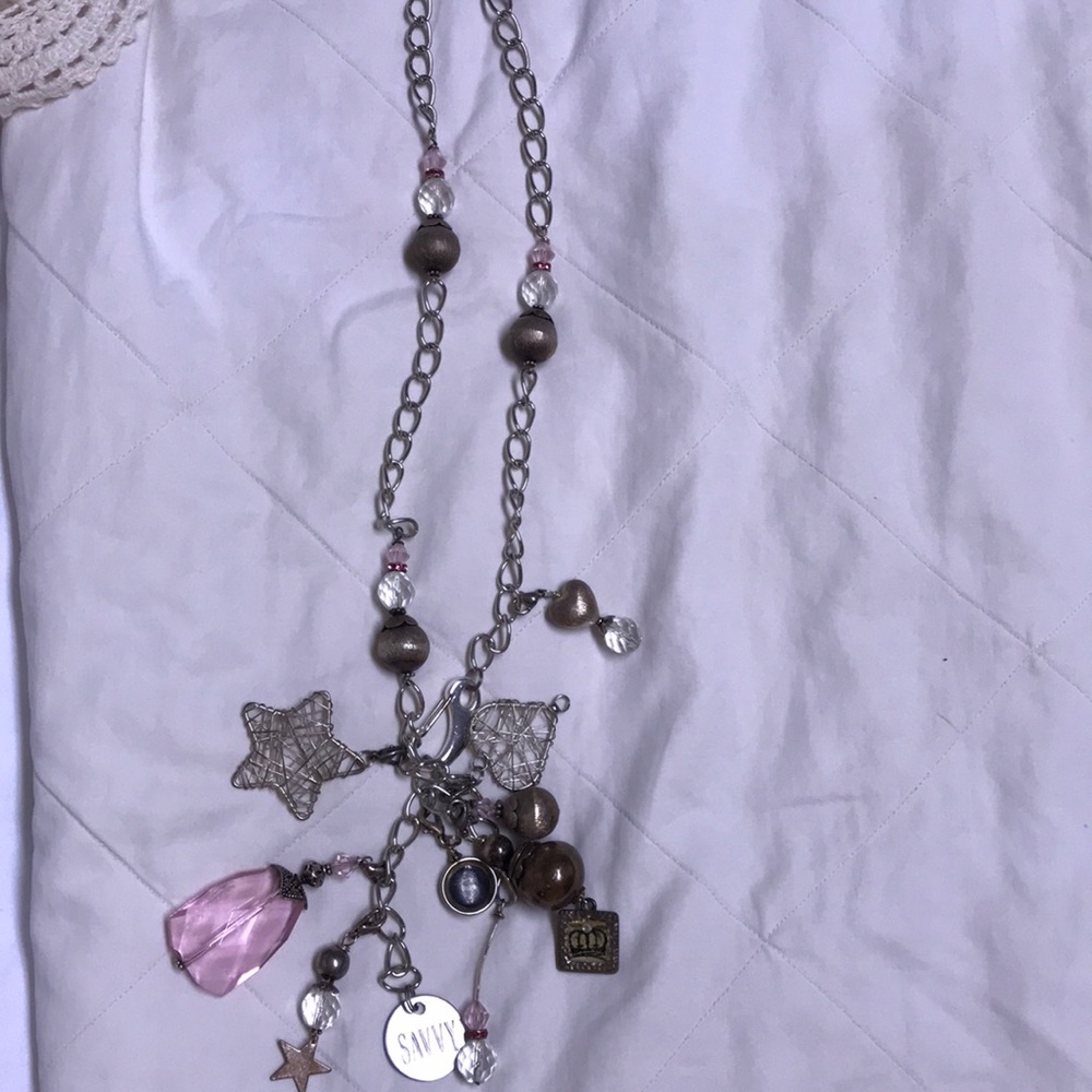 Super cute necklace with various charms.